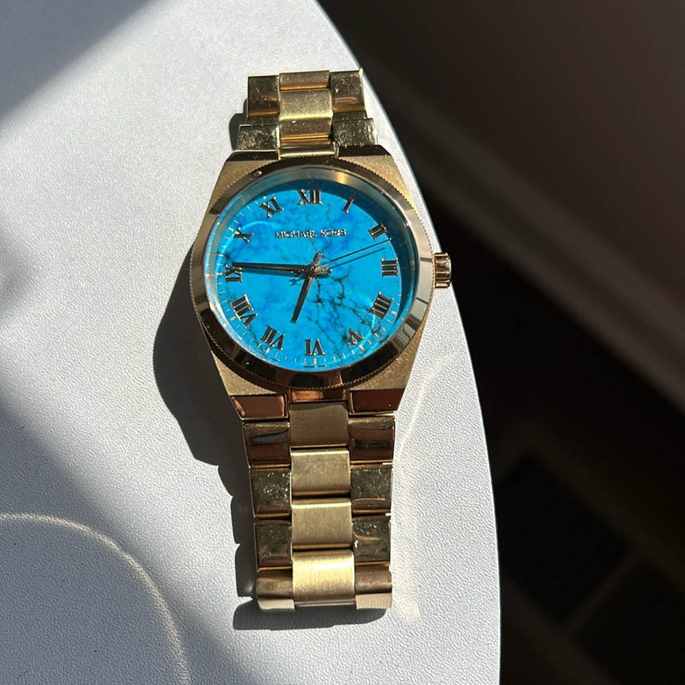 Gold Michale Kors watch w/ Turquoise face